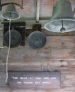 Historic exhibit of loud vintage bells with warning sign Royalty Free Stock Photo